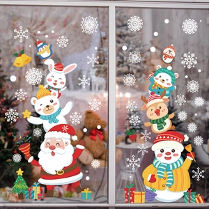 Festive Christmas window stickers with Santa, snowman, and reindeer on glass display
