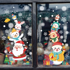 Christmas window stickers set featuring Santa, snowman, and reindeer on glass display