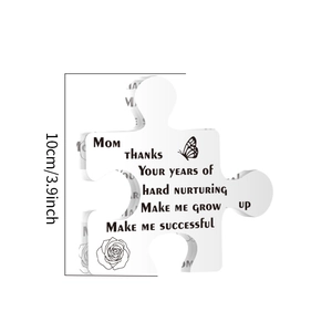Detail of puzzle-shaped acrylic gift with floral engraving and 10cm size marking