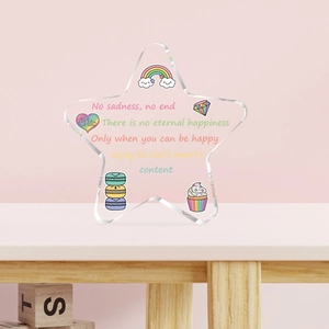 Star-shaped acrylic table decoration with rainbow and cupcake illustrations