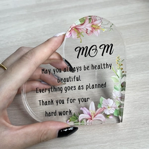 Detail of heart acrylic plaque with floral prints and warm message for mothers