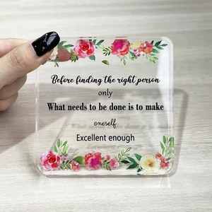 Square acrylic ornament with watercolor flowers and motivational quote on a wooden background