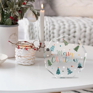 Detailed view of nonagon clear acrylic Christmas plaque with festive tree design and base