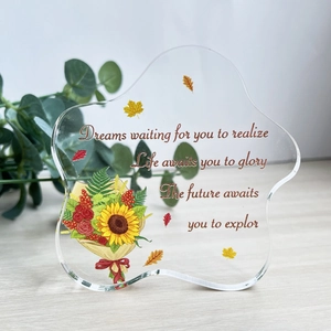 Irregular acrylic sunflower desk ornament with inspirational quotes on wooden surface