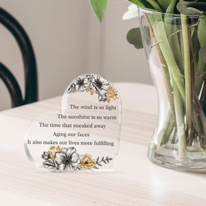 Clear heart-shaped acrylic desktop decor with floral sketch and inspirational English poem