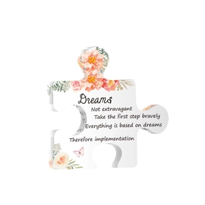 Puzzle-shaped acrylic plaque with floral print and motivational quote for desk decoration