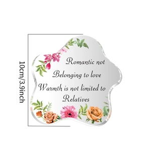 Detail of flower pattern and sentimental quote on cloud-shaped acrylic heart ornament
