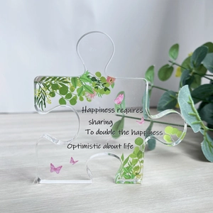 Puzzle-förmige Acryl-Tischplatte mit grünen Blättern und motivierenden Zitaten