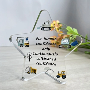 Star-shaped acrylic table decor with construction vehicles and inspirational quotes