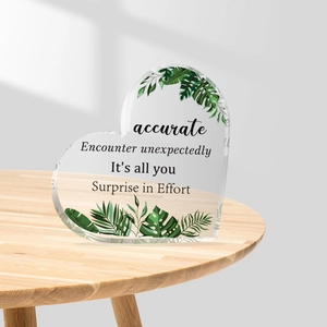 Transparent acrylic heart-shaped decor with tropical green leaves and inspirational quotes