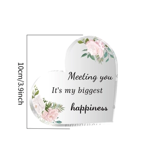 Detail of heart acrylic ornament with pink roses and meeting you happiness quote