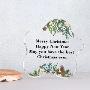 Irregular star-shaped acrylic Christmas ornament with botanical prints and Merry Christmas text