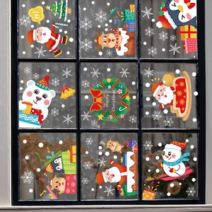 Christmas window stickers set featuring Santa, reindeer and snowman on glass pane