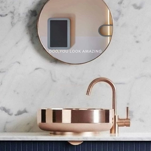 Modern rose gold round vessel sink set with backlit mirror featuring amazing slogan