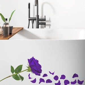 Detailed view of dark purple rose wall stickers applied on a white bathtub side surface