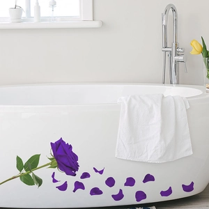 Romantic purple rose wall sticker applied on white bathtub in a modern bathroom