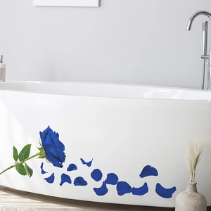 Blue rose wall sticker set on a modern white bathtub with scattered petal details