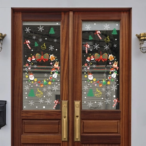 Christmas window decals with Santa Claus, reindeer and snowflakes on glass door