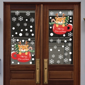 Merry Christmas window stickers featuring reindeer and snowflakes on a glass door