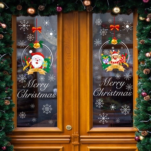 Festive Santa and Reindeer window static stickers on glass door with snow elements