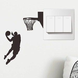 Detail showing a black silhouette of a basketball player dunking as a light switch decal