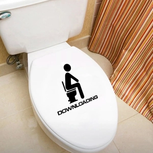 Detailed view of a funny black bathroom wall sticker with the text DOWNLOADING for toilet decor