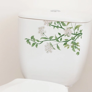 Sticker de plantes vertes et fleurs blanches sur réservoir de toilettes pour décoration