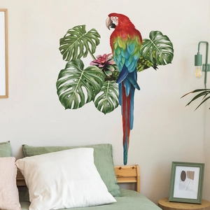 Tropical macaw and monstera leaf wall stickers in a cozy bedroom scene