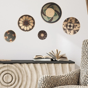5-piece set of woven seagrass wall baskets with bohemian tribal geometric patterns