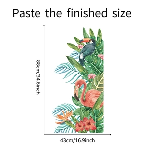 Detail view of tropical wall decals featuring flamingos and monstera leaves with dimensions
