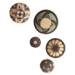Detail view of 5-piece handmade woven wall baskets with ethnic geometric patterns