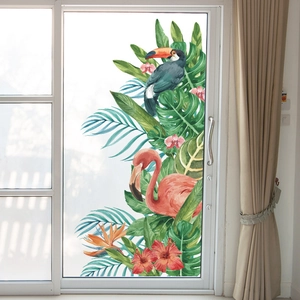 Tropical wall sticker with flamingos and monstera leaves on a glass door background