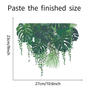 Detail view of tropical leaf wall sticker showing 27x23cm dimensions on white background