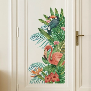 Tropical wall sticker with pink flamingo, toucan and monstera leaves on a white door