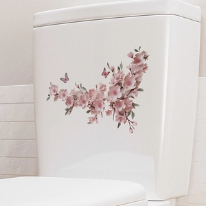 Waterproof pink cherry blossom and butterfly wall decals on white toilet tank