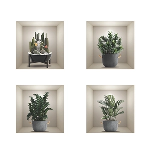 Detailed view of four assorted artificial potted green plants in decorative grey pots