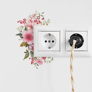 Floral wall sticker with pink flowers and green leaves around a white electrical switch