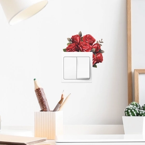 Romantic red rose wall stickers around a light switch in a bright, modern home setting