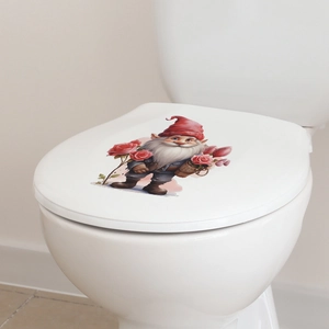Detail of waterproof gnome and pink rose wall sticker applied on a white toilet lid