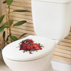 Close-up of heart-shaped red rose and butterfly decals on a white ceramic toilet lid