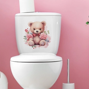Detail of cartoon bear and rose flower sticker applied on a white toilet tank
