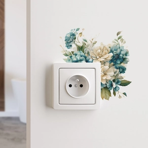 Detail of blue and white floral switch sticker on wall showing matte PVC texture