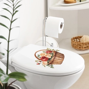 Detail of floral rose basket sticker on a white toilet lid in a cozy bathroom