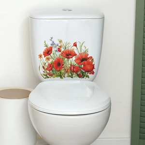 Detail of red poppy flower wall stickers applied to a white ceramic toilet tank surface