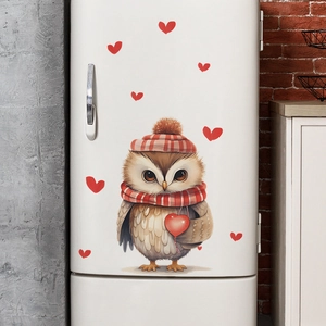 Detailed view of cartoon owl wall stickers and red hearts on a white refrigerator surface