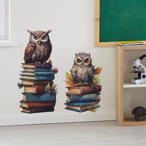 Detail of cartoon owls on books wall decals with autumn maple leaves and vintage colors