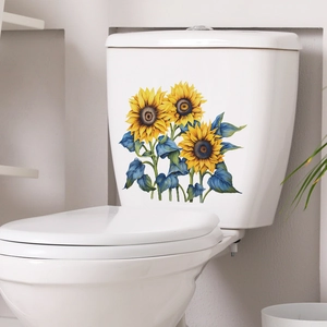 Artistic sunflower bathroom wall sticker with blue leaves on a white ceramic toilet tank