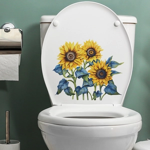Sunflower toilet seat decal with bright yellow petals and blue leaves on white surface
