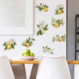 Detailed view of fresh lemon and leaf wall decals applied to a white dining room wall