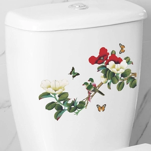 Floral toilet sticker with birds and blossoms on a white ceramic tank background